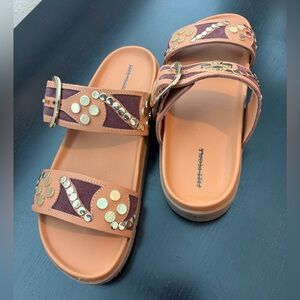 Free People Revelry studded sandals in a tan/vachetta color and gold-tone studs